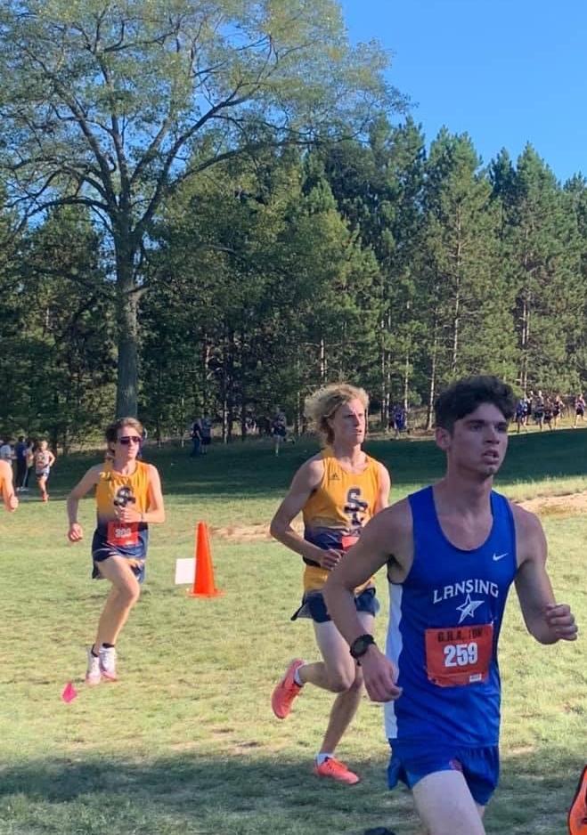 2 Sc4 cross country runners running 